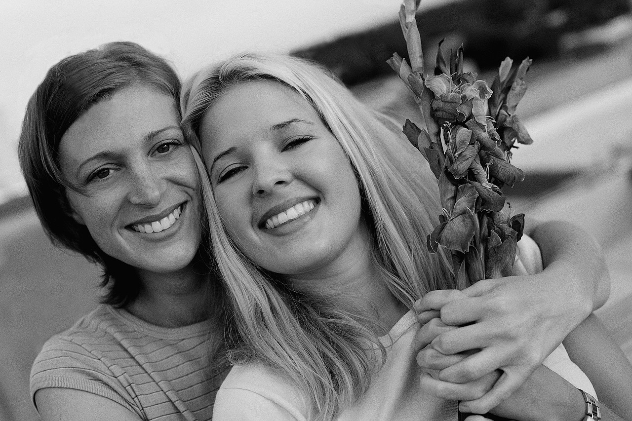 Girlfriends Holding Flowers