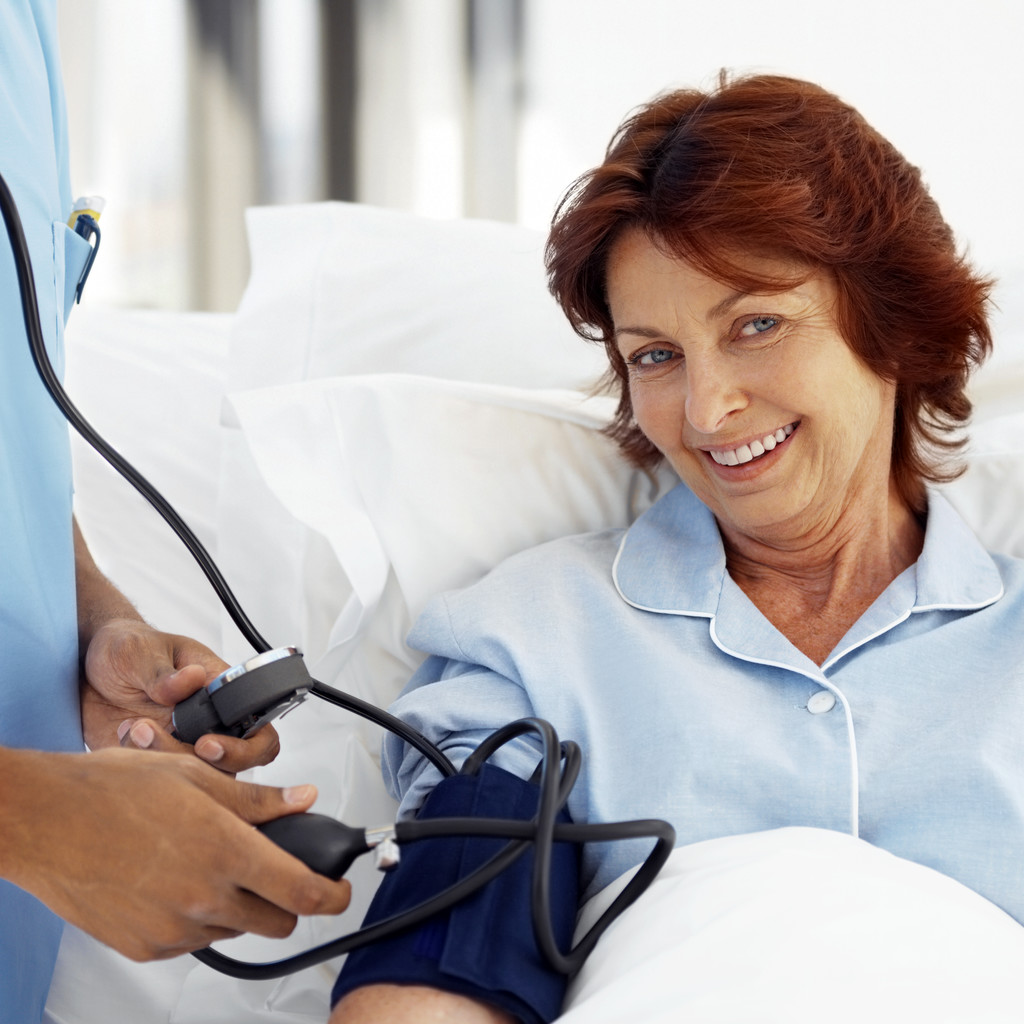 Elderly Female Patient Wearing a Blood Pressure Gauge