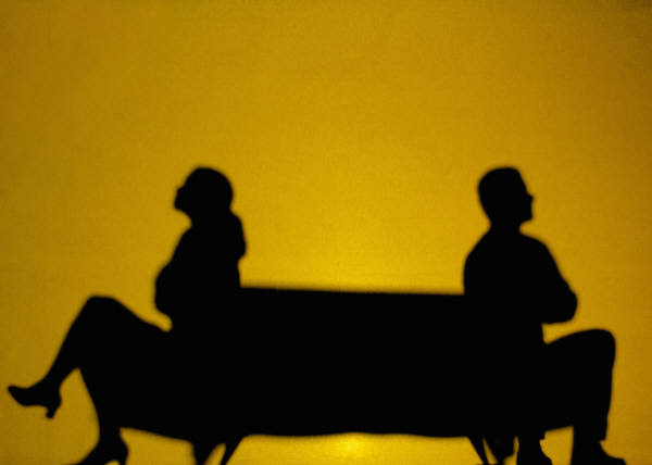 silhouette of a man and woman arguing