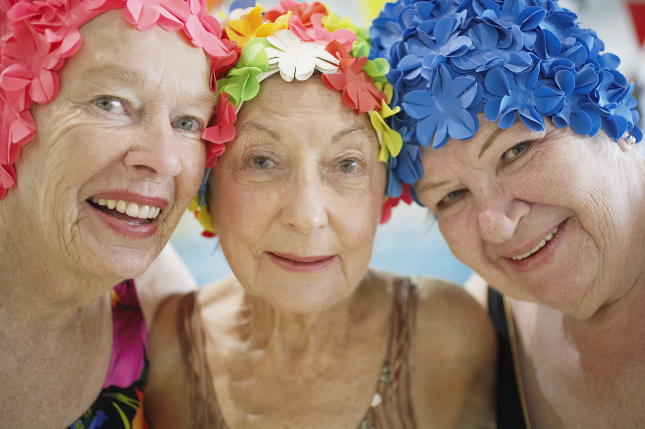 Women Wearing Colorful Bathing Caps