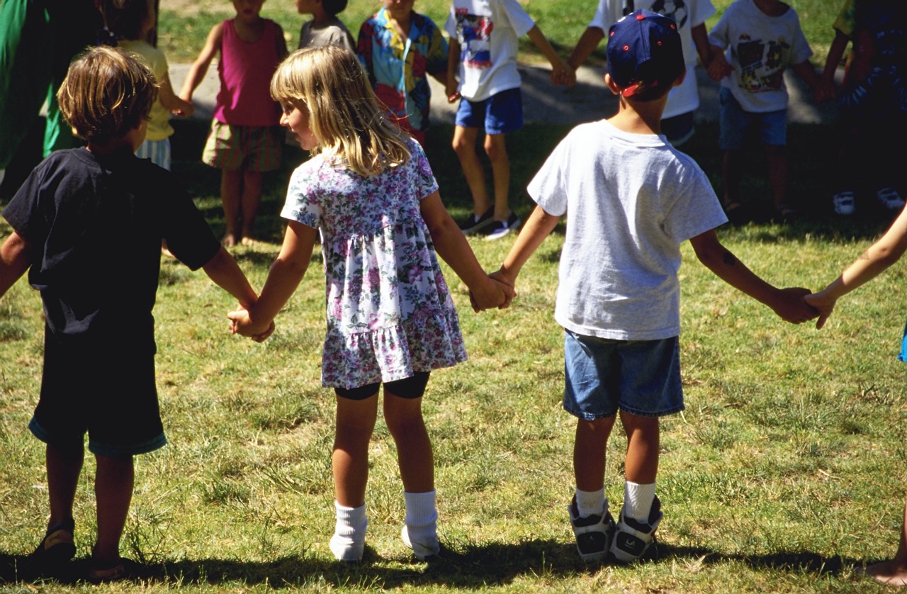 Children Holding Hands on School Playground