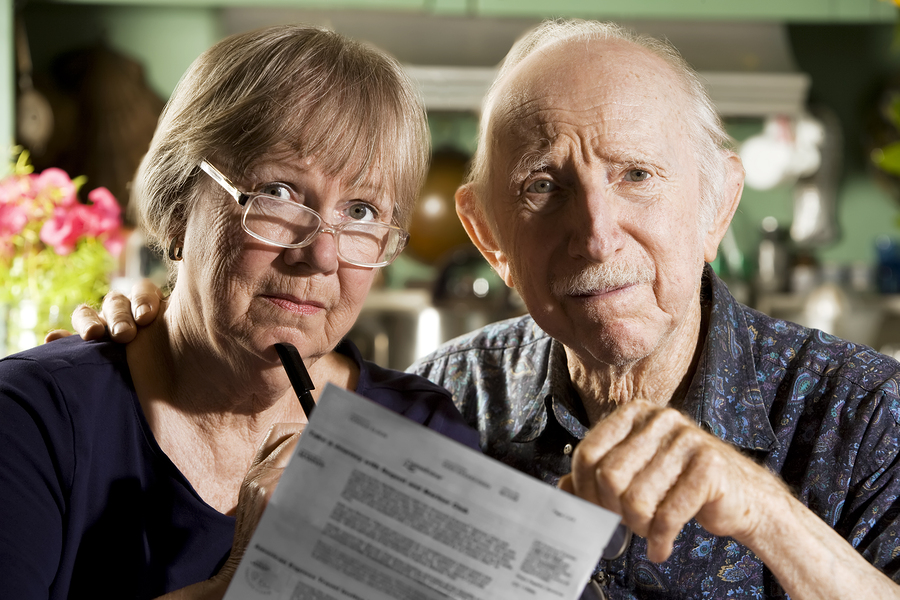 Elder Couple with Bills