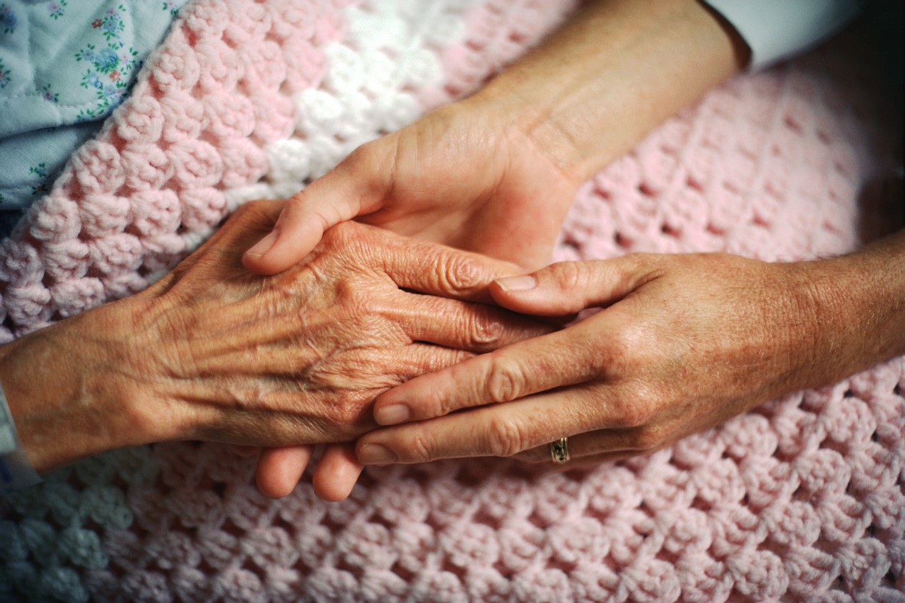 Holding Hands with Elderly Patient