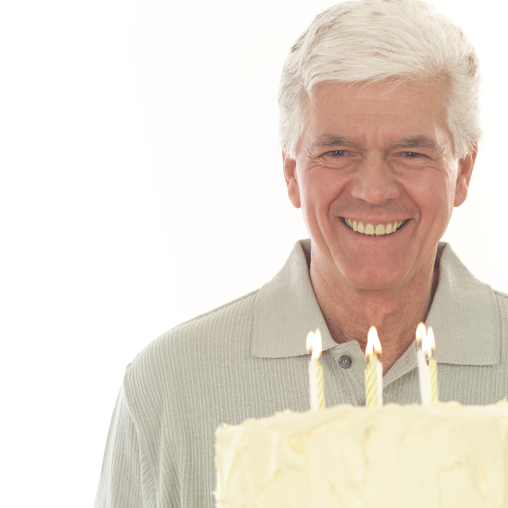Middle aged Man with Birthday Cake