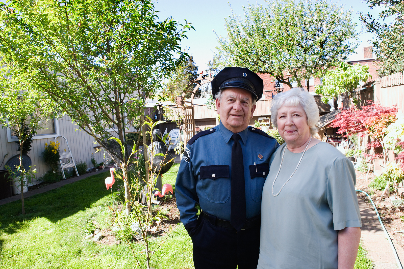 couple standing outside their garden