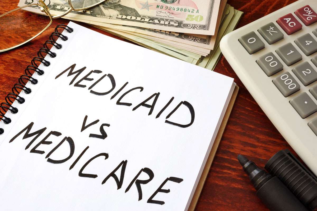 Medicaid vs Medicare written in a note.