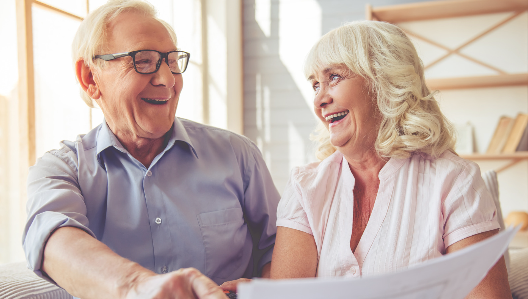 Elder couple looking over their letter of competency