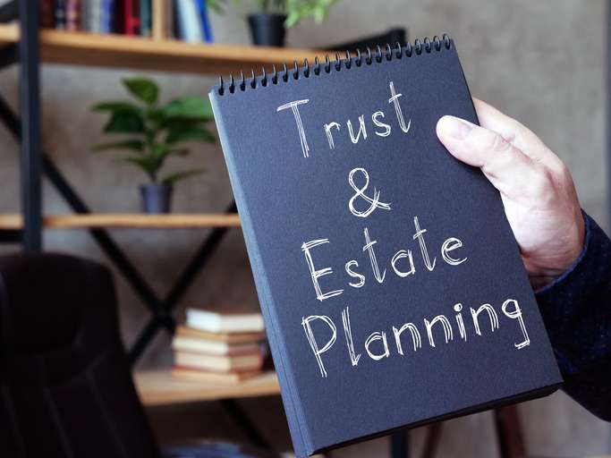 Trust and Estate Planning is shown on a conceptual business photo