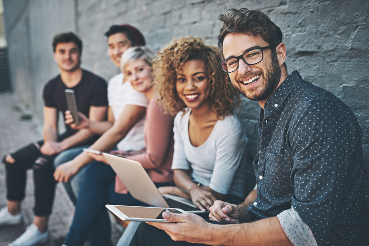 Shot of a diverse group of people social networking outside