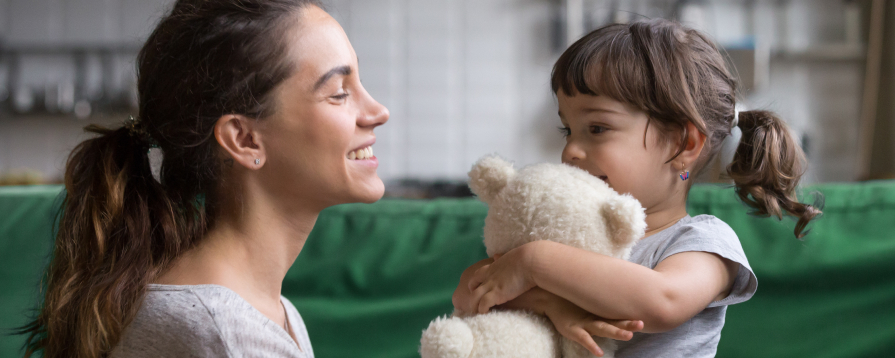 Attorney meeting with family about guardianship paperwork in a New York courtroom hallway